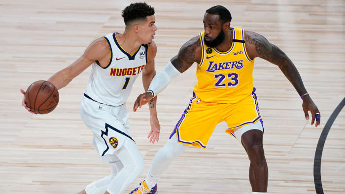 Los Angeles Lakers' LeBron James pressures Denver Nuggets' Michael Porter Jr.